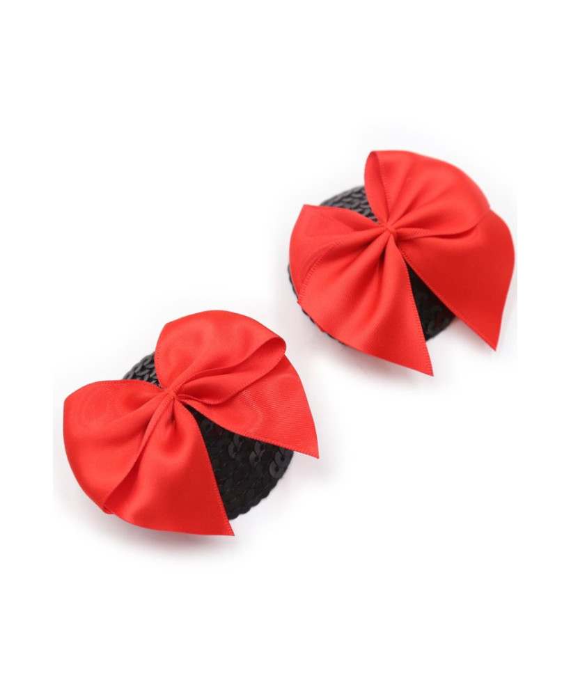 Paire de cache tétons adhésifs noir avec nœud papillon rouge 